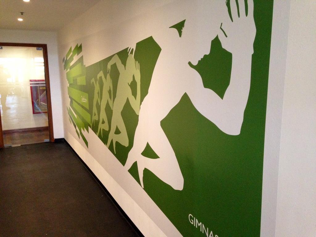 Radisson Hotel Colonia Del Sacramento Exterior photo Gymnastics Australia's logo on the wall of the National Academy of Sporting Excellence