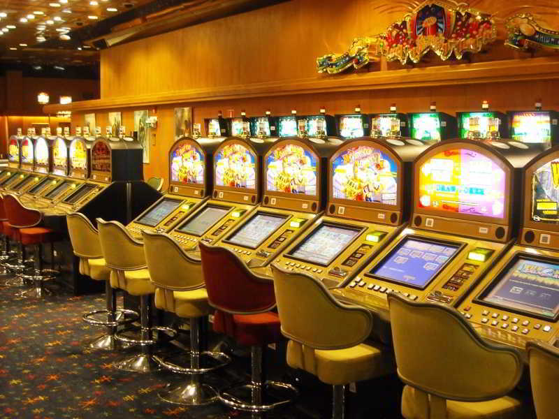 Radisson Hotel Colonia Del Sacramento Exterior photo A row of pachinko machines